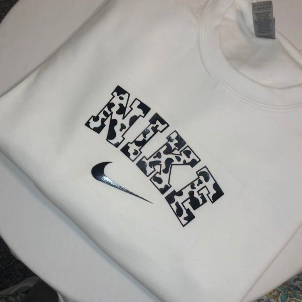 nike cow print crewneck